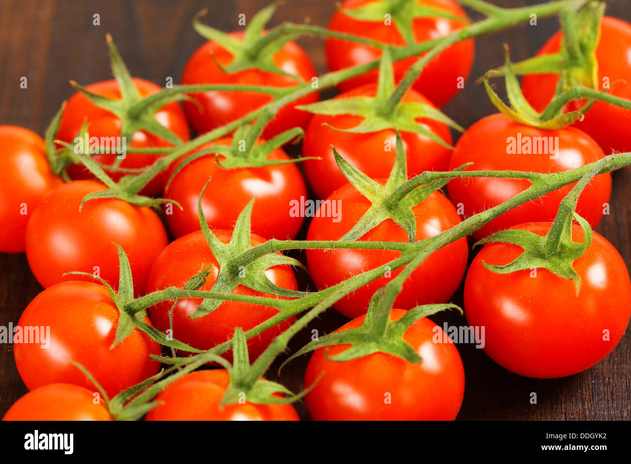 Bunches of fresh red tomatoes Stock Photo - Alamy