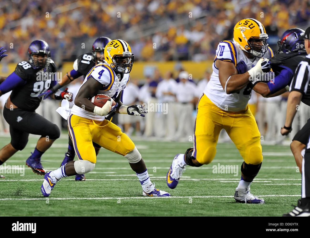 Aug. 31, 2013 - Aug. 31,2013:.LSU Tigers running back Alfred Blue (4) carries the ball inside the one as he gets blocking from LSU Tigers offensive tackle La'el Collins (70).in a NCAA football game between the LSU Tigers and the TCU Horned Frogs at AT&T Stadium in Arlington, Texas.. Stock Photo
