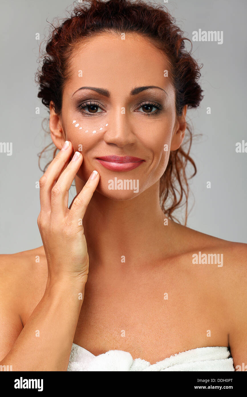 Natural middle aged woman with cream Stock Photo