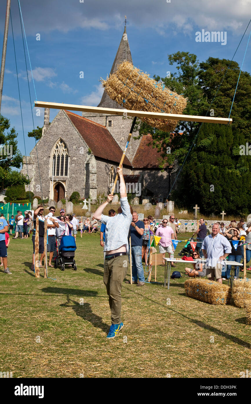 Hay Bale Tossing, The Alfriston Festival, Sussex, England Stock Photo