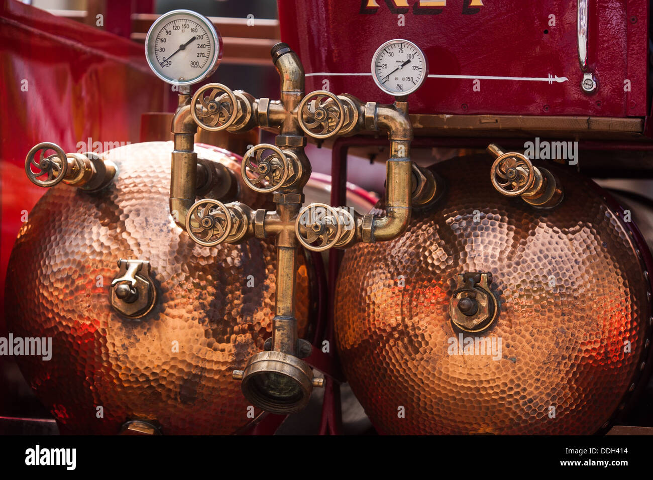 copper water tanks on a vintage fire truck Stock Photo