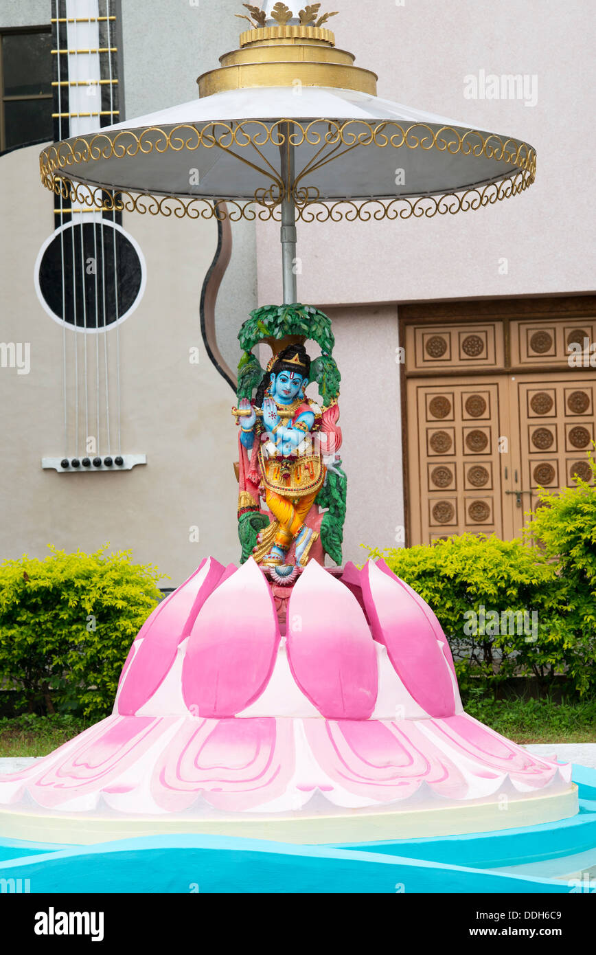 Krishna statue outside in front of a music college in the town of Puttaparthi, Andhra Pradesh, India Stock Photo