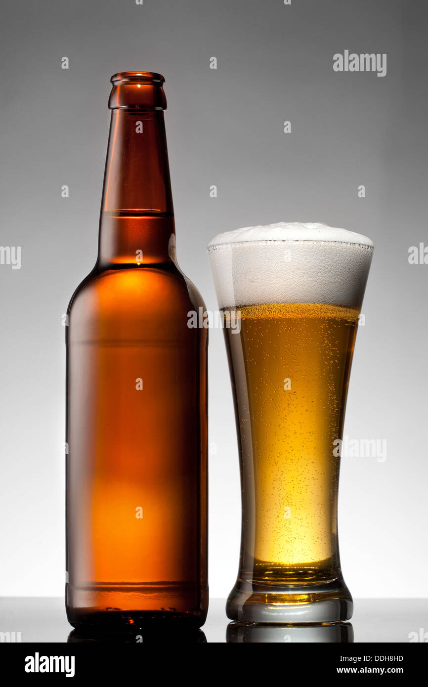 Beer in glass and bottle on white Stock Photo Alamy