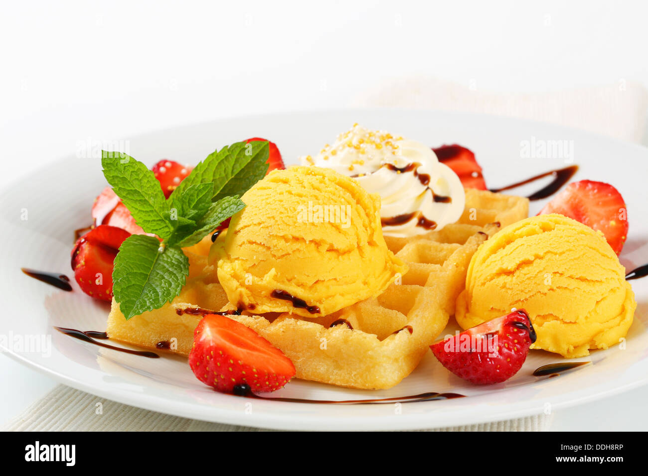 Belgian waffle with fresh strawberries and ice cream Stock Photo - Alamy