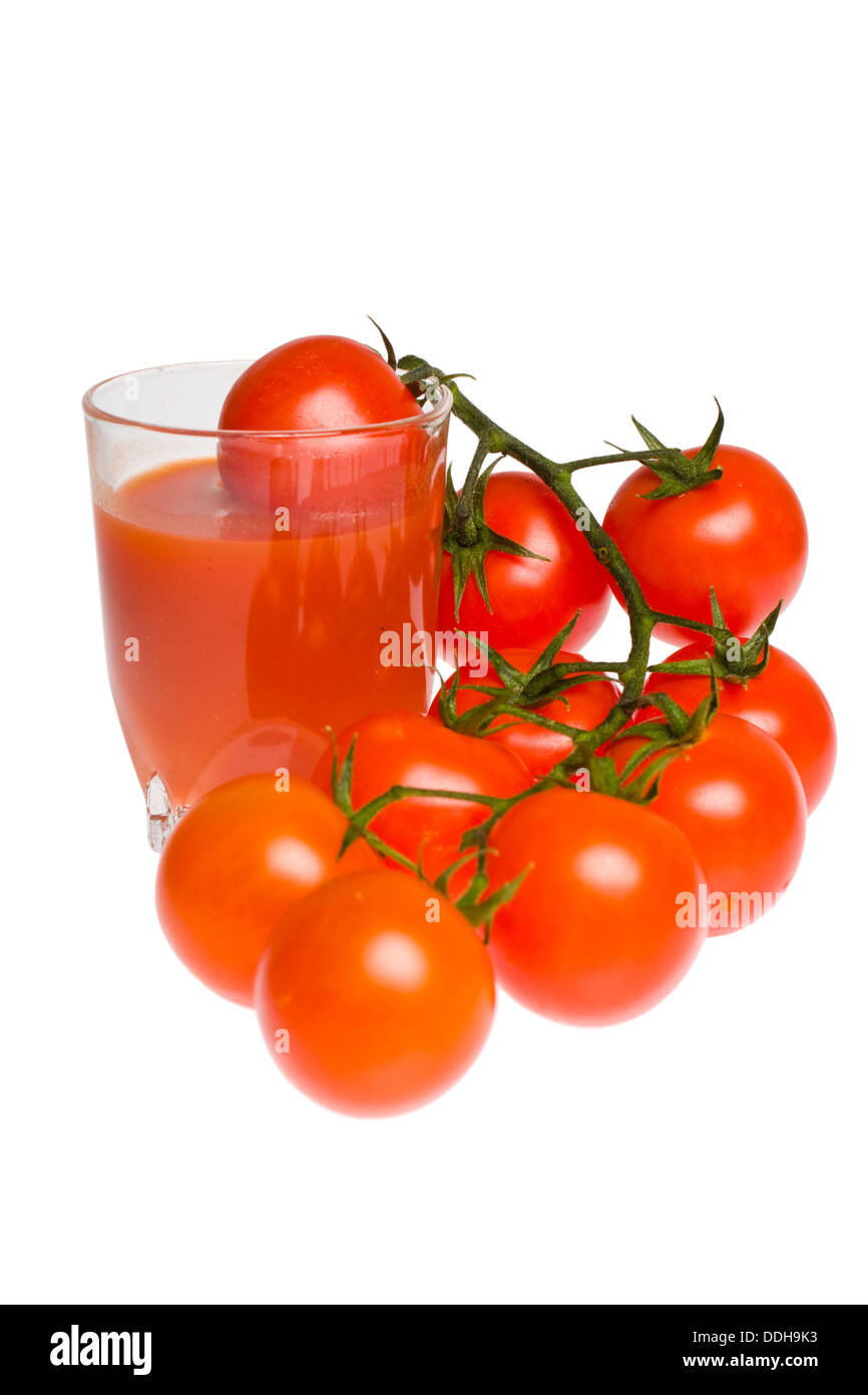 bunch of tomatoes and glass of tomato juice Stock Photo Alamy