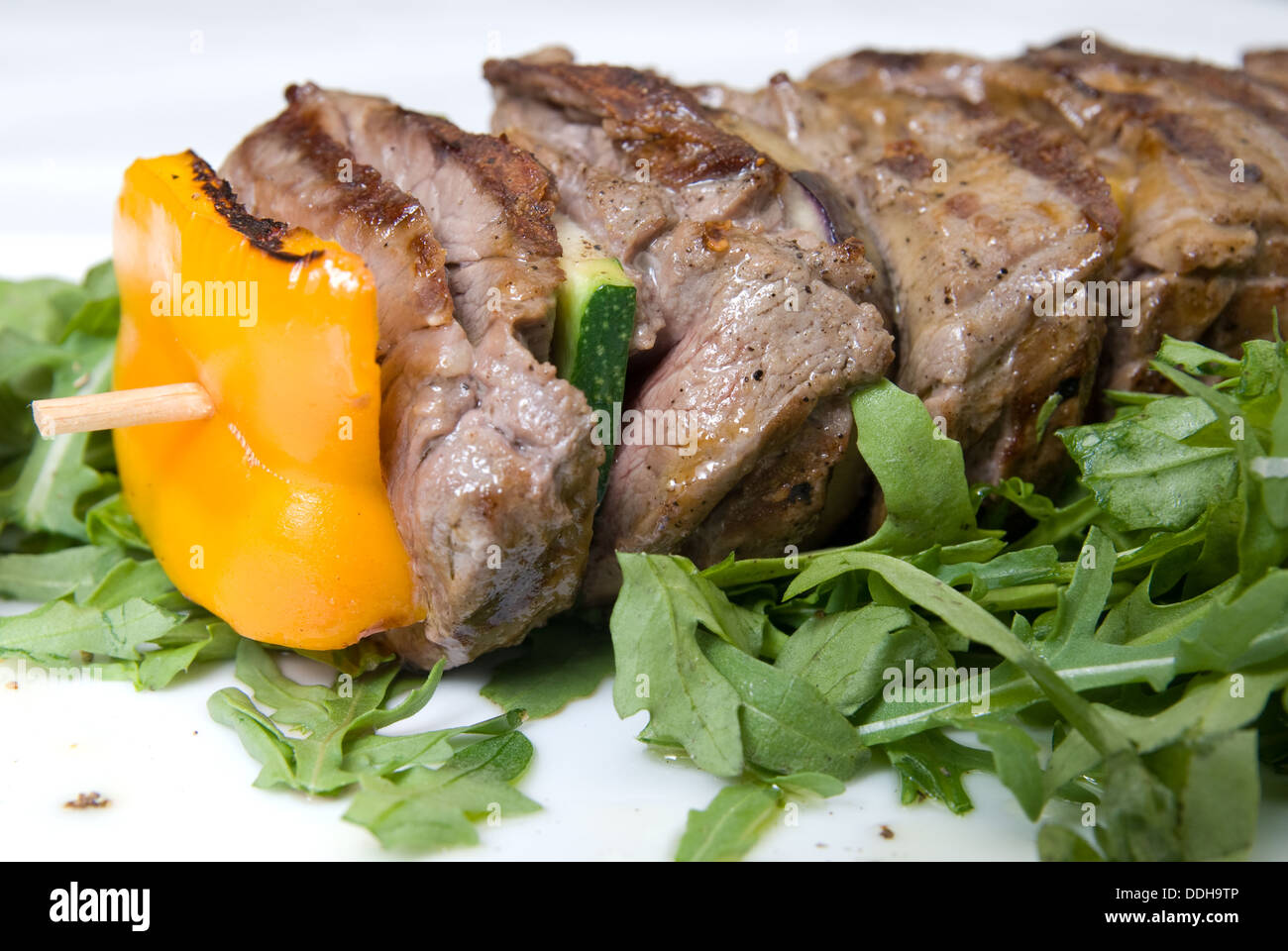 shashlik with potherbs on the plate Stock Photo