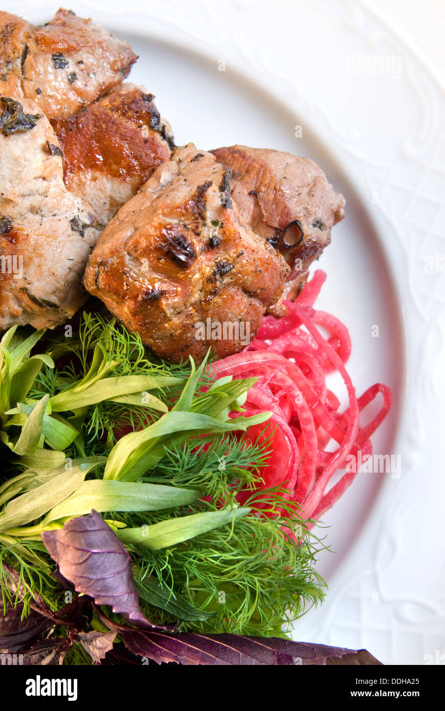 shashlik with potherbs on the plate Stock Photo