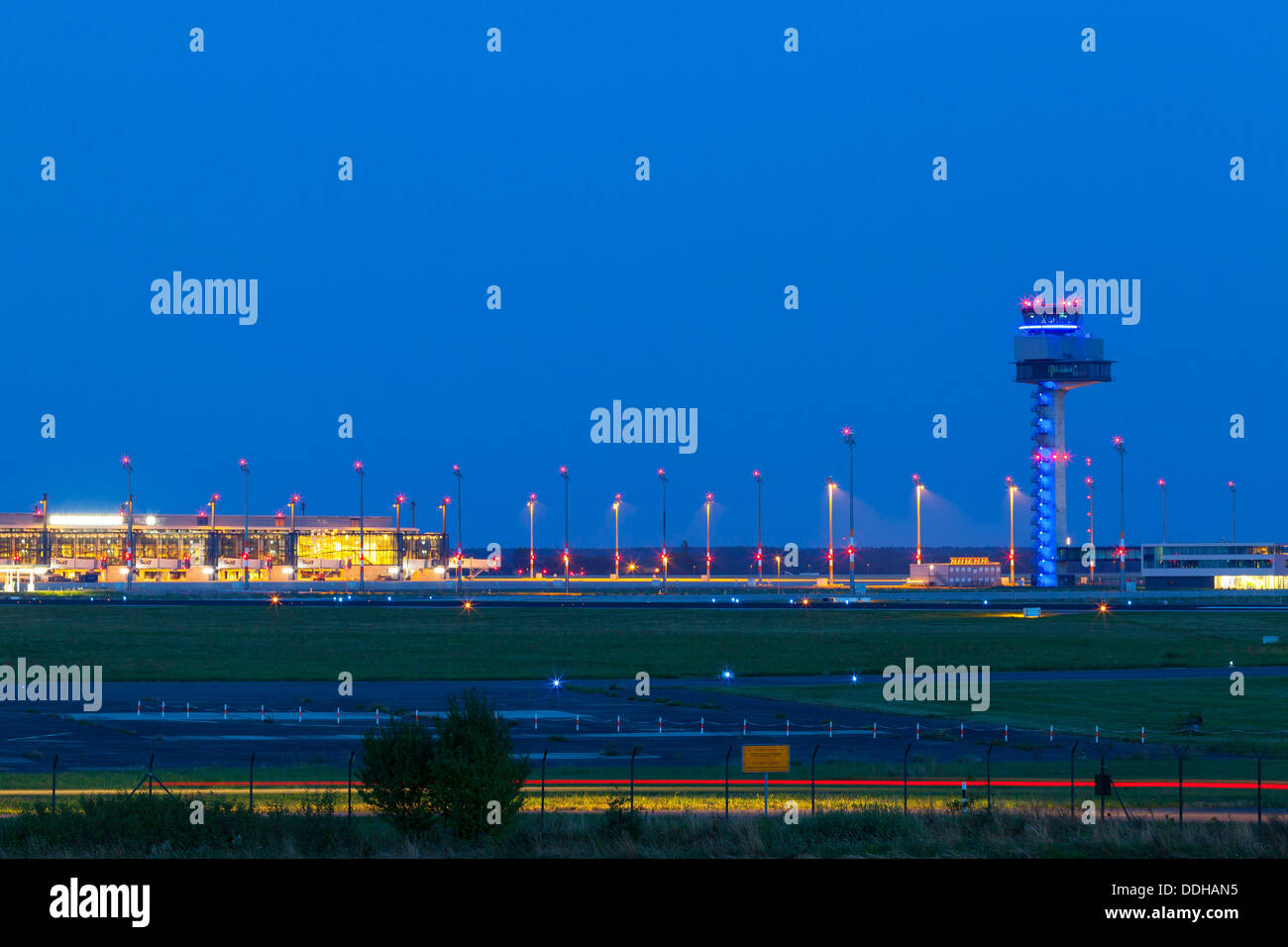 Germany/Brandenburg/Wassmannsdorf, Berlin Brandenburg Airport (BER) with tower seen from Wassmansdorf at night, 22 Aug 2013 Stock Photo