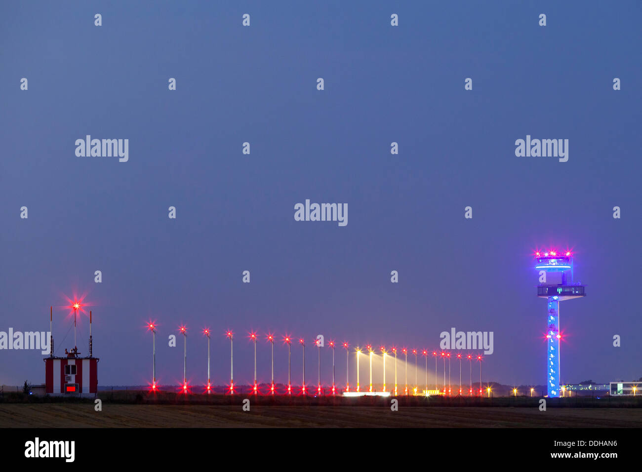 Germany/Brandenburg/Wassmannsdorf, Berlin Brandenburg Airport (BER) with tower seen from Wassmansdorf at night, 22 Aug 2013 Stock Photo