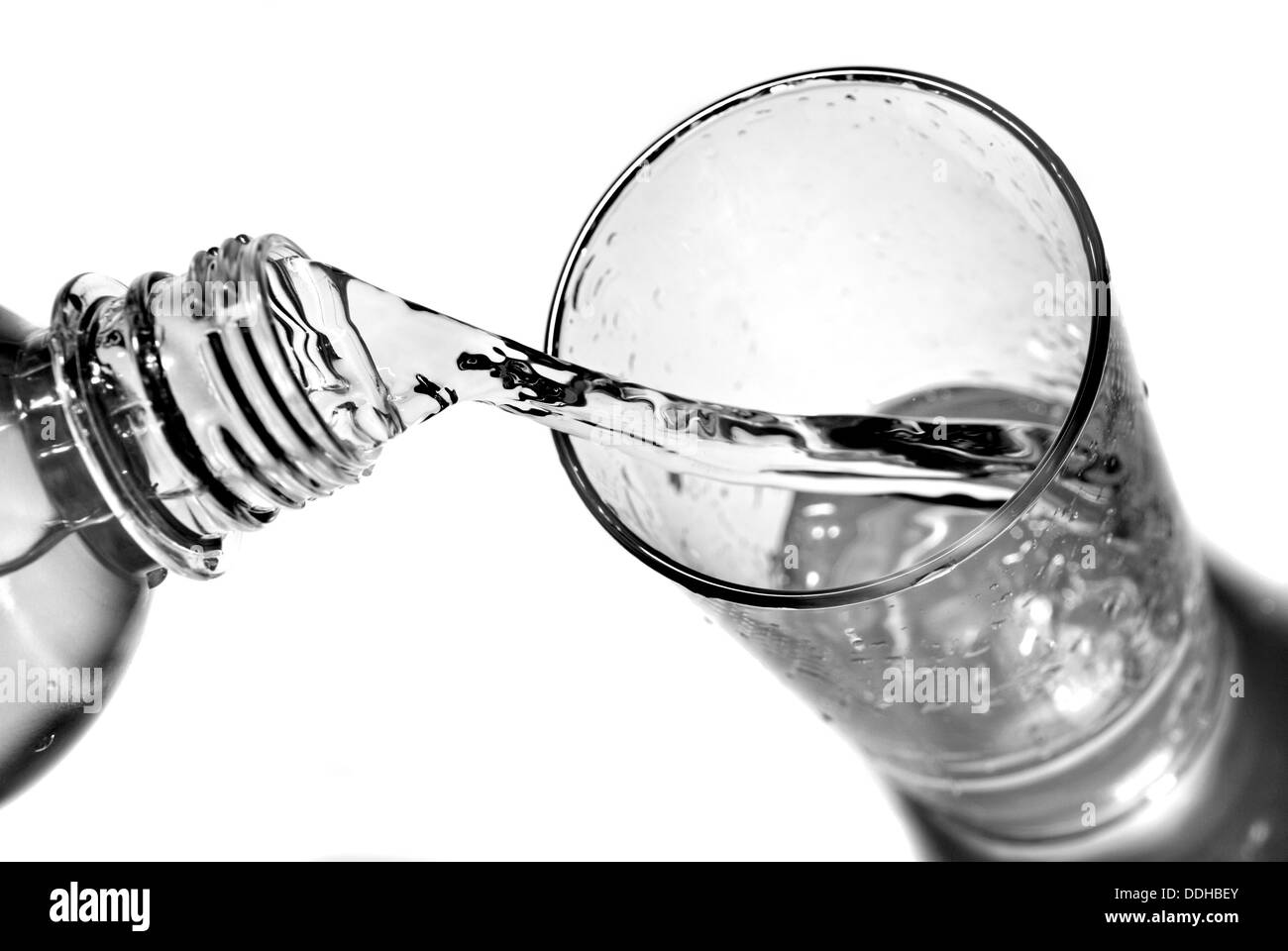 water pouring into glass from bottle isolated on white Stock Photo Alamy
