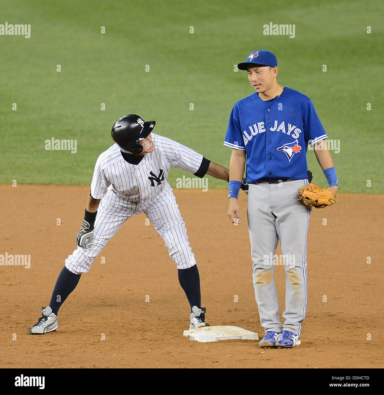 L-R) Ichiro Suzuki (Yankees), Munenori Kawasaki (Blue Jays), AUGUST 20,  2013 - MLB : Ichiro Suzuki of the New York Yankees talks with shortstop Munenori  Kawasaki of the Toronto Blue as he