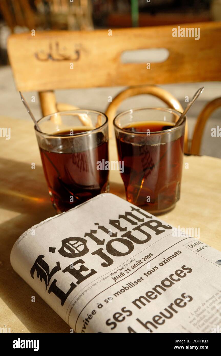 Middle East,french language newspaper and cups of tea Stock Photo