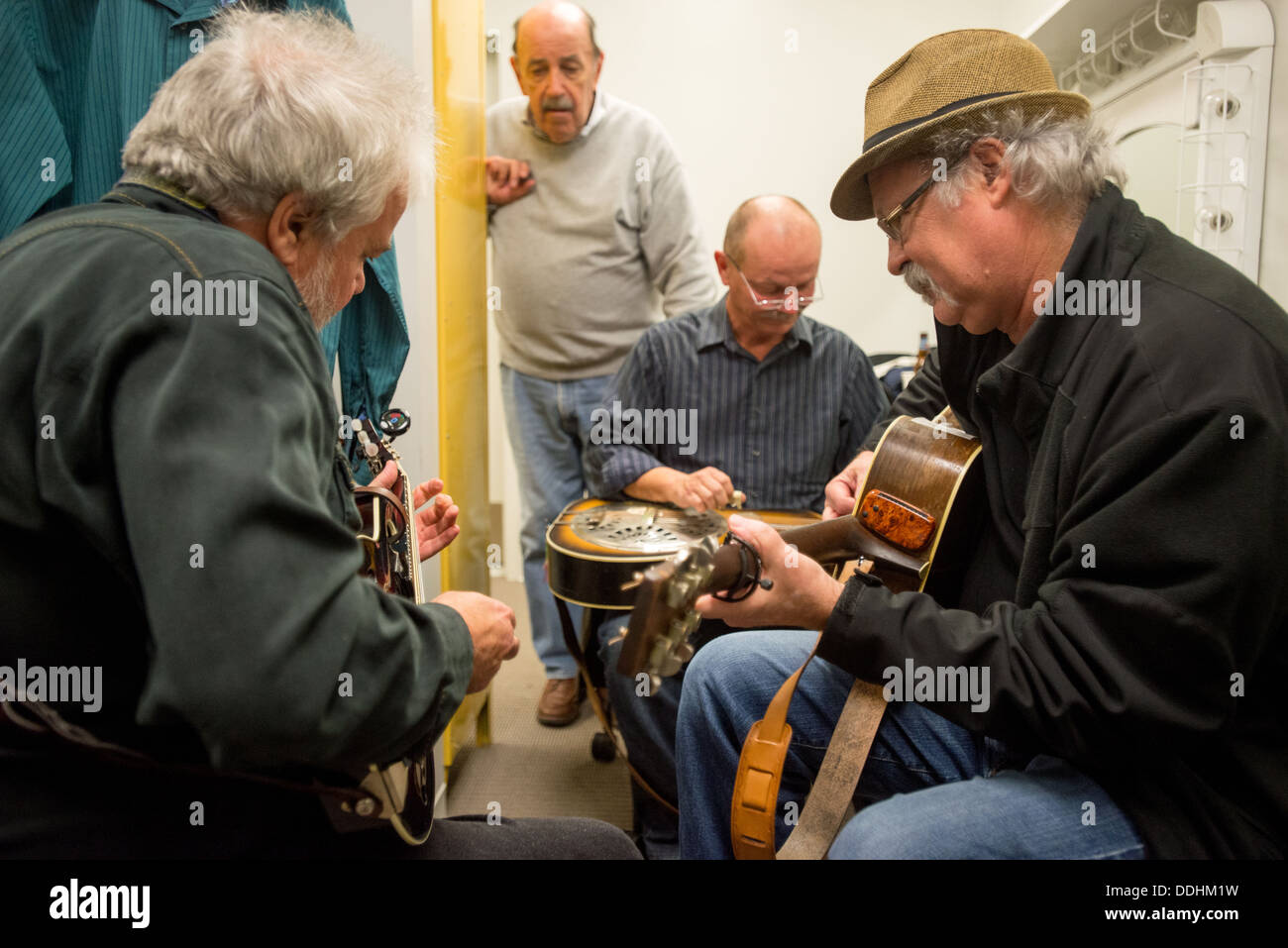 Seldom Scene bluegrass band tuning before a performance Stock Photo