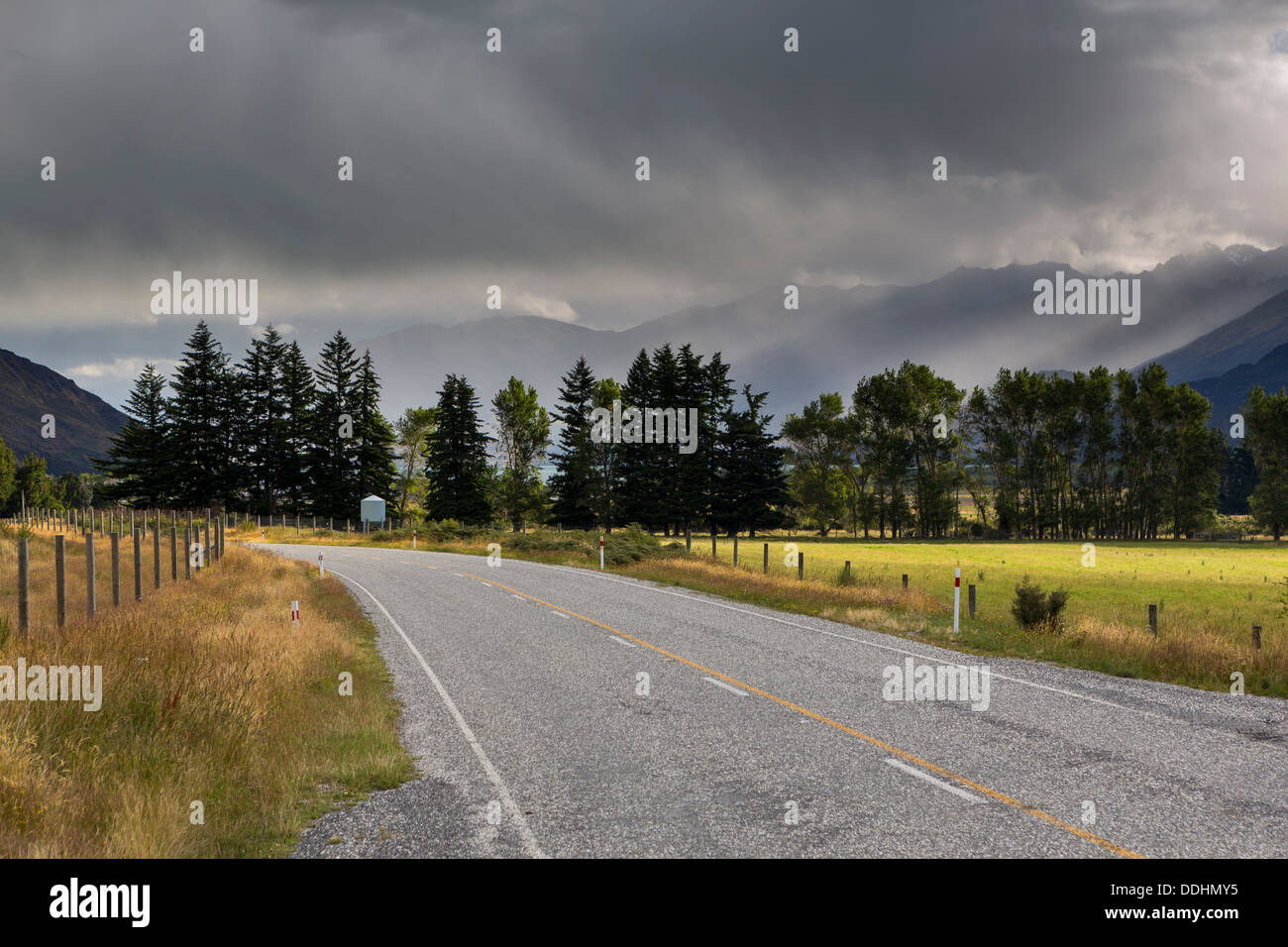 Highway, rain clouds above Lake Wanaka Stock Photo