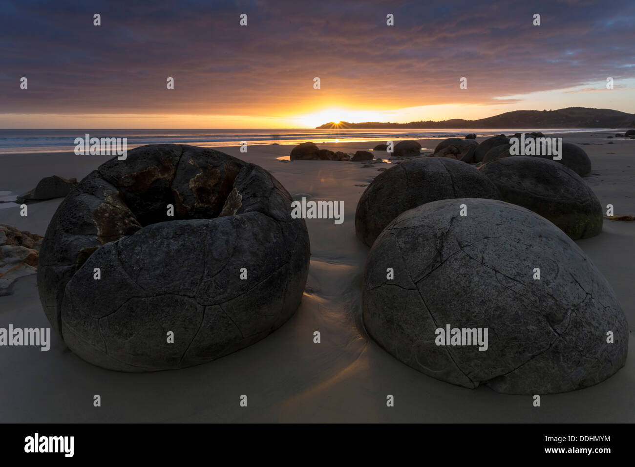 Moeraki Boulders on the beach at sunrise Stock Photo