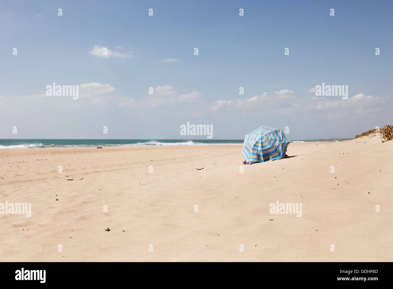 Spain, View of umbrella by beach Stock Photo Alamy