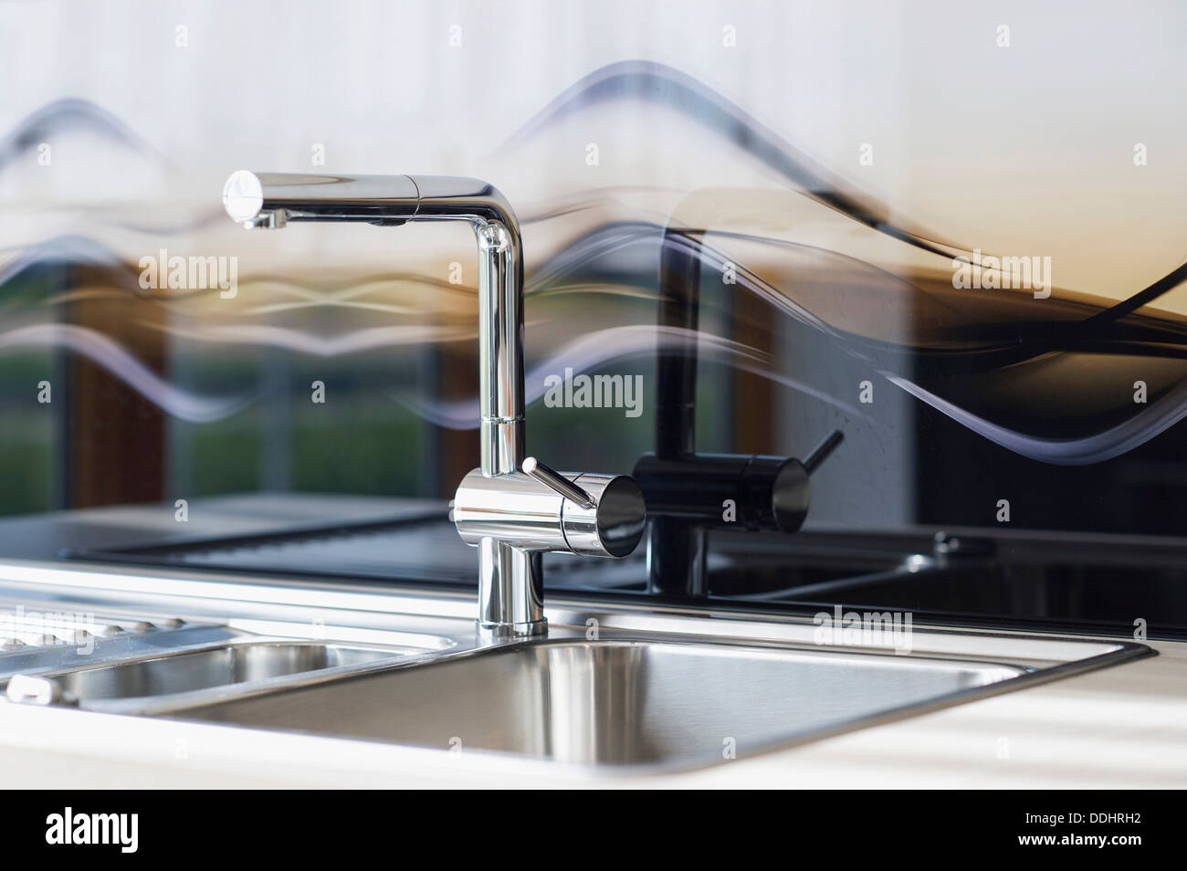 Modern sink in a kitchen Stock Photo - Alamy