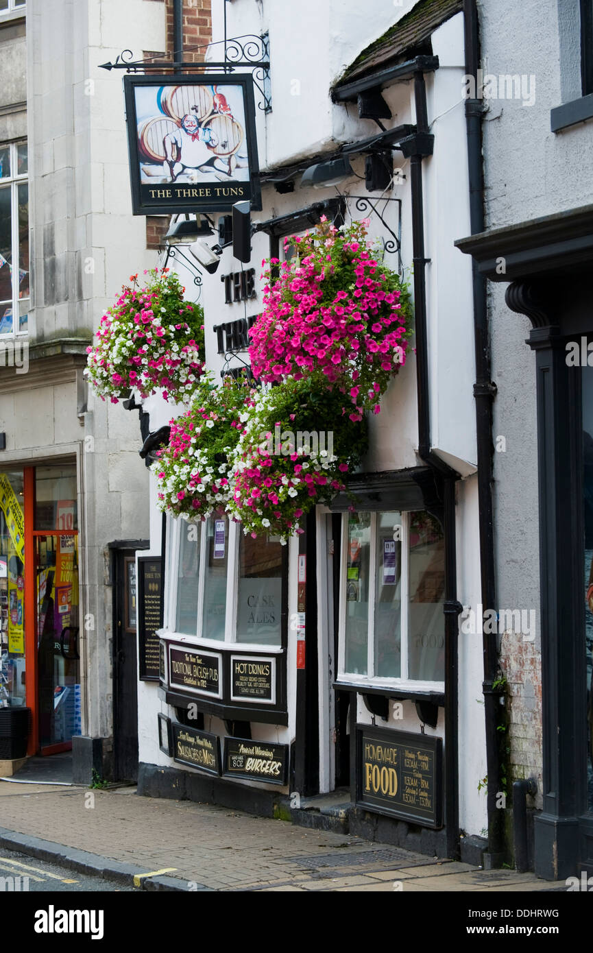 THE THREE TUNS traditional local pub hanging baskets outside in the