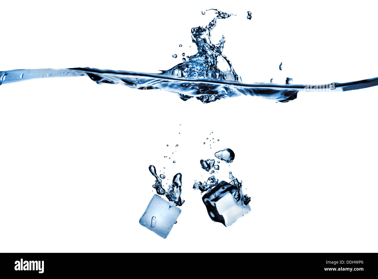 ice cubes dropped into water with splash isolated on white Stock Photo ...