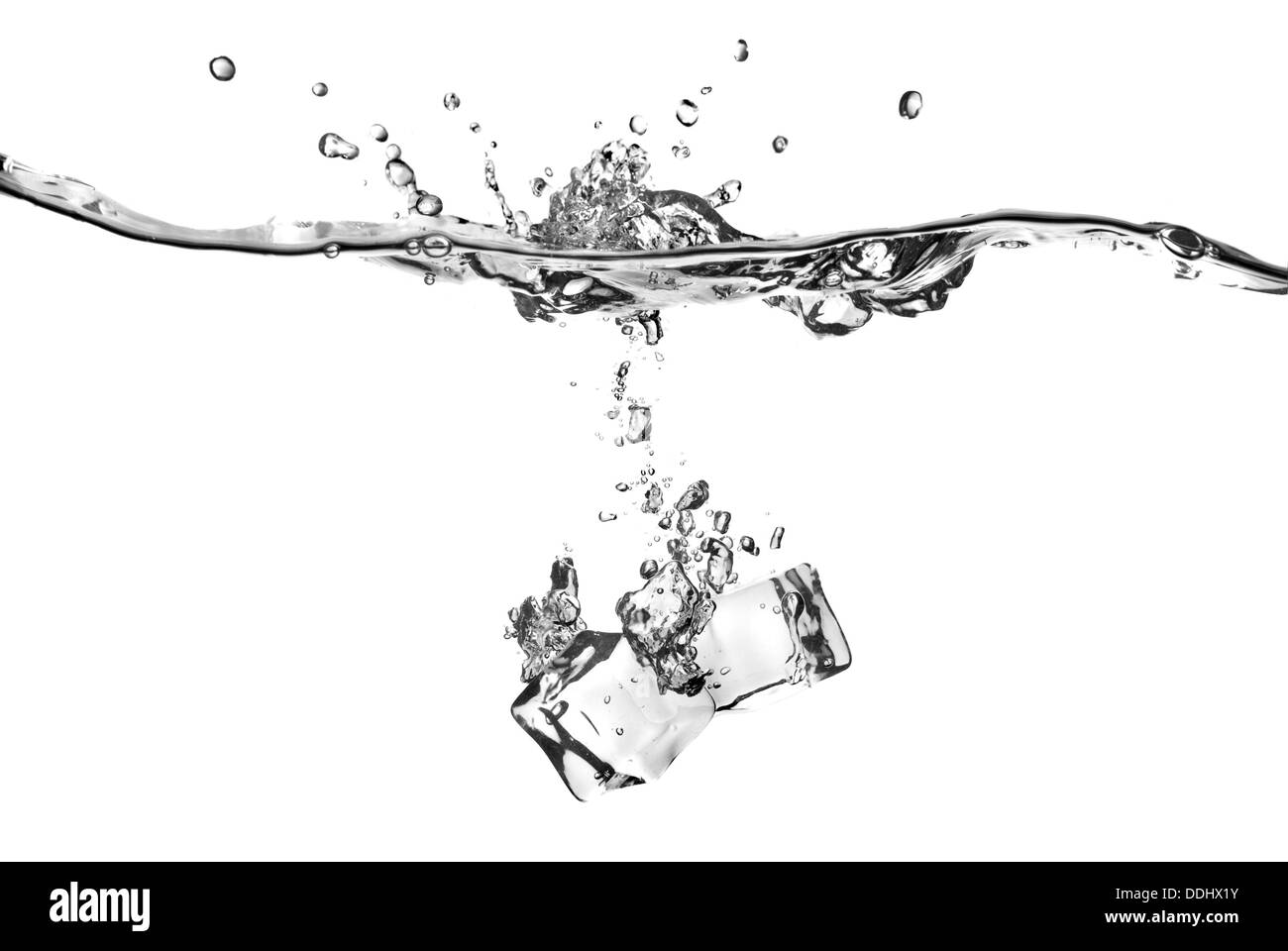 ice cubes dropped into water with splash isolated on white Stock Photo ...