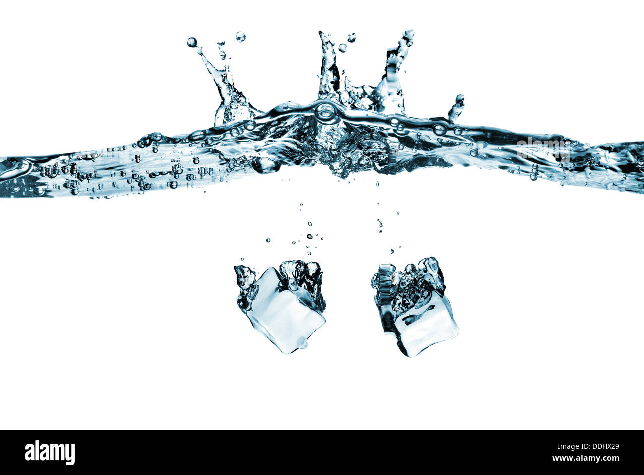 ice cubes dropped into water with splash isolated on white Stock Photo ...