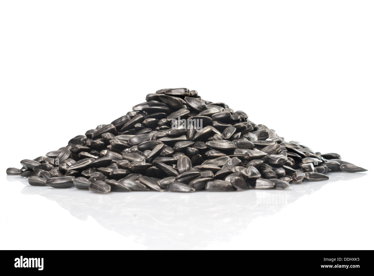 pile of black sunflower seeds isolated on a white background Stock ...