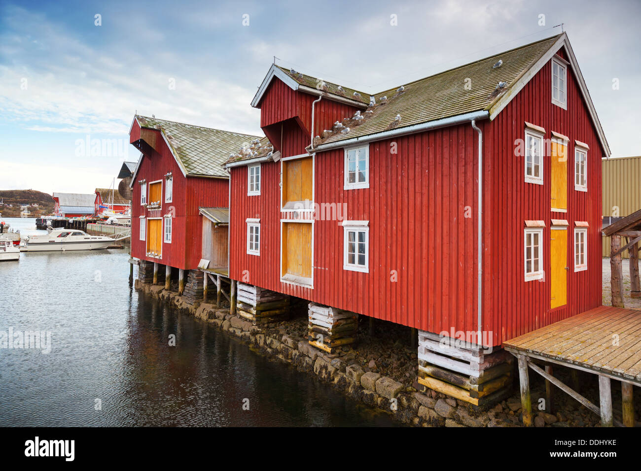 Red and yellow wooden coastal houses in Norwegian fishing village