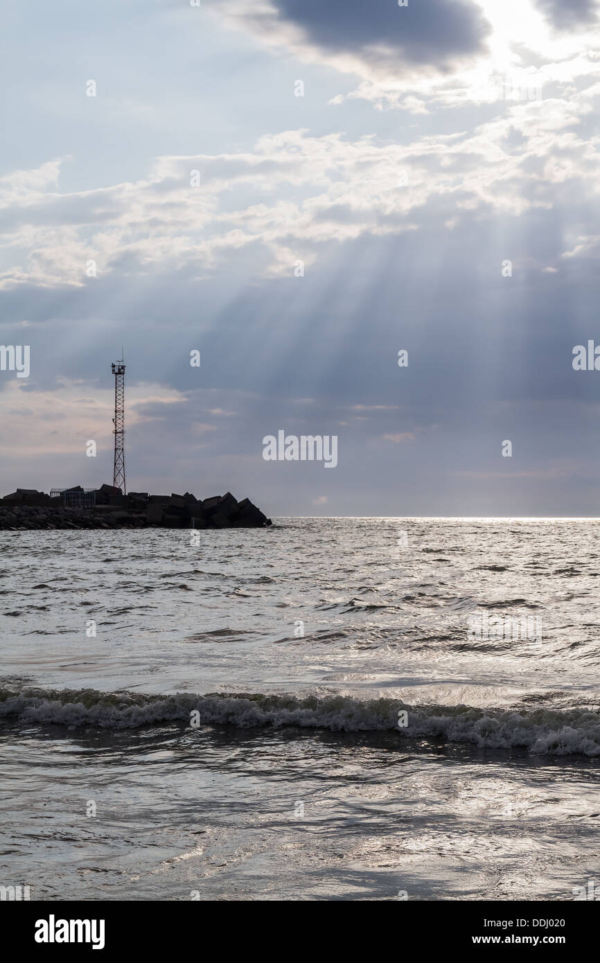 the sun's rays penetrate through clouds over the Baltic Sea, Klaipeda, Lithuania Stock Photo