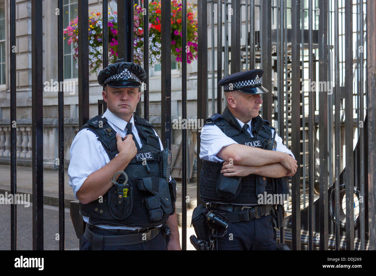 Downing Street gates and armed police presence Stock Photo
