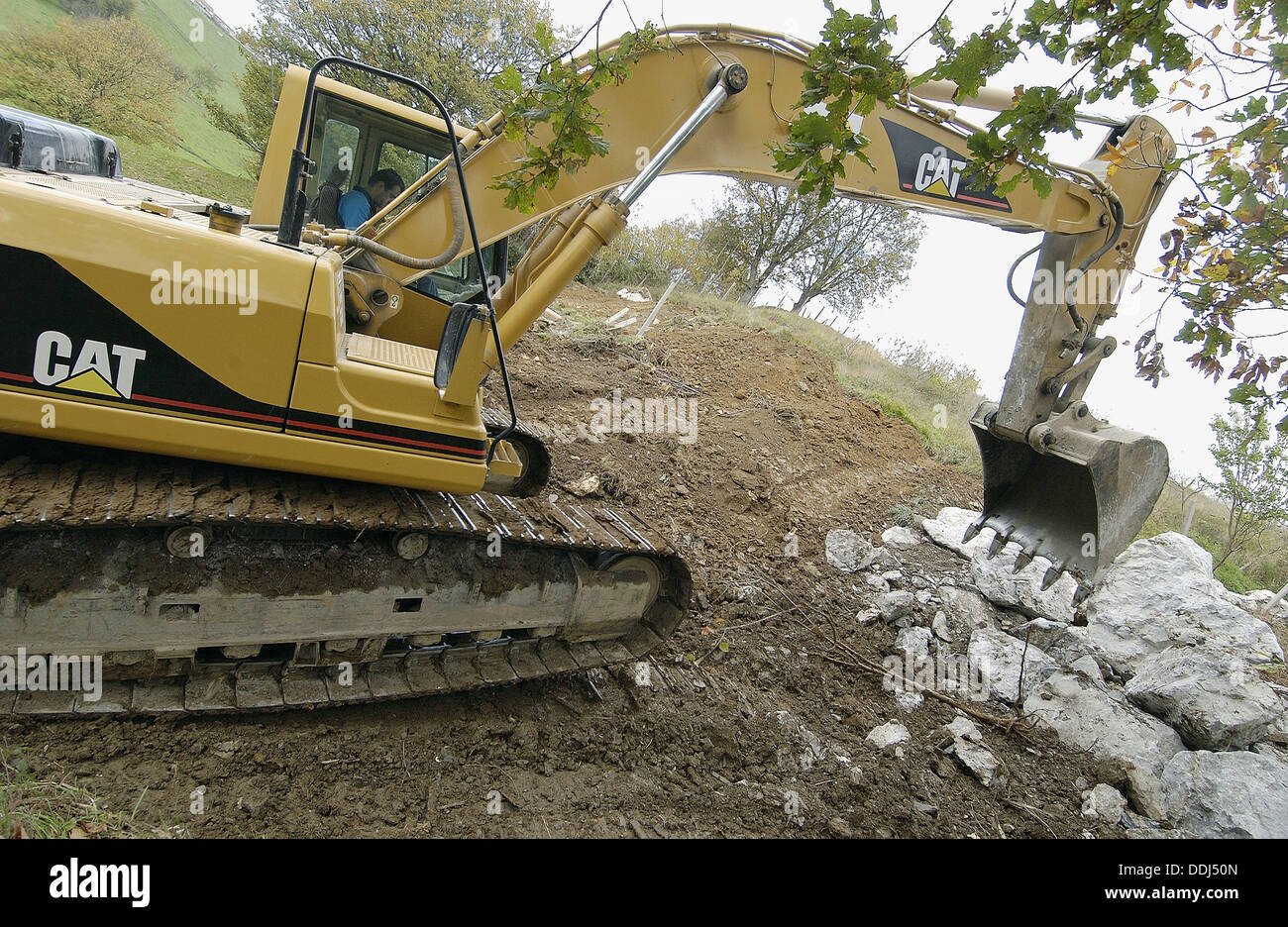 Loading rocks at quarry for construction of breakwater Stock Photo - Alamy