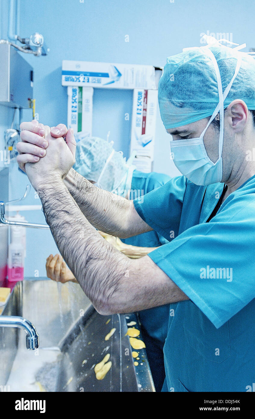 Surgeons washing hands at traumatology operating room of hospital Stock