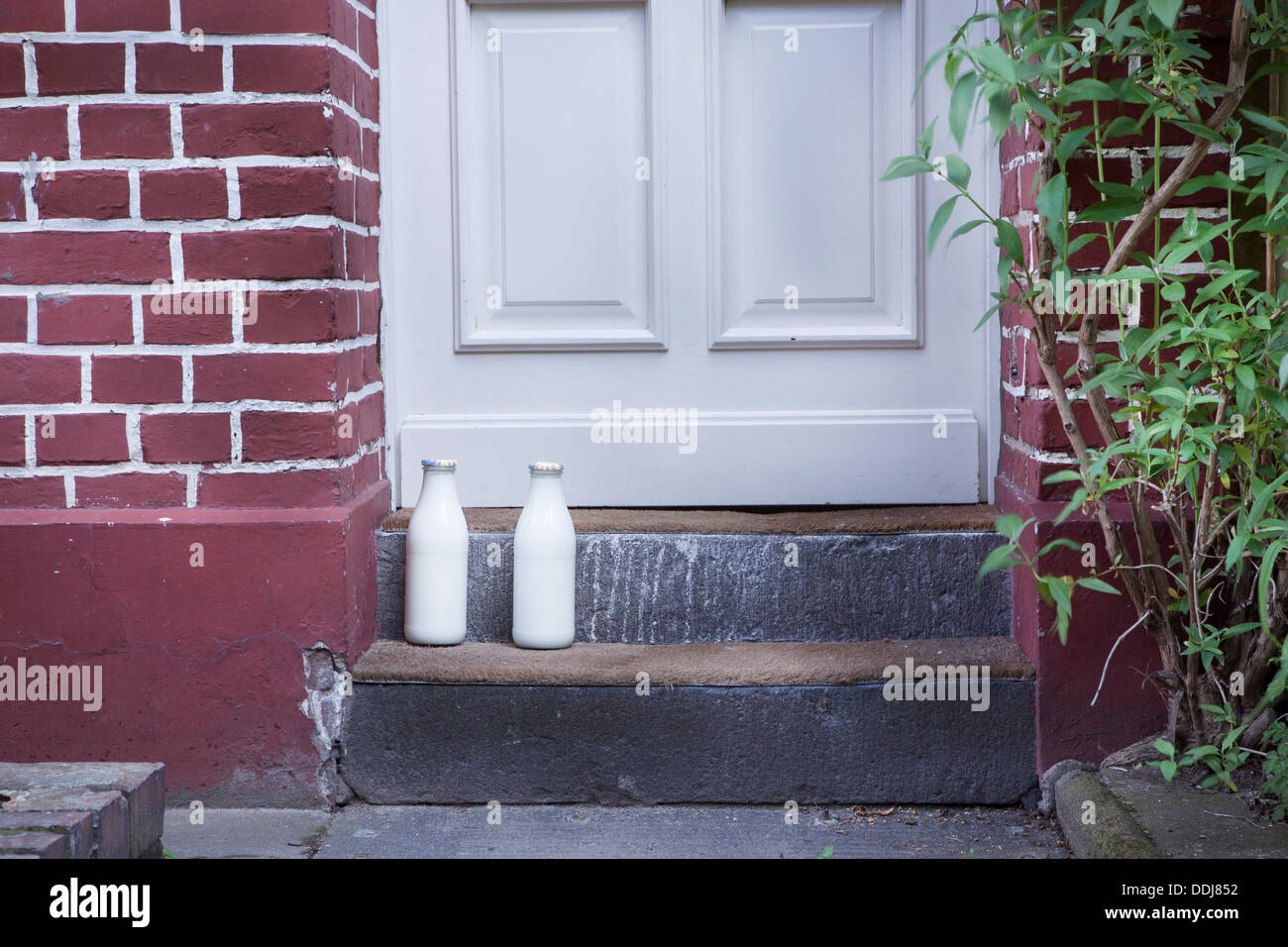 Milk bottle on doorstep Stock Photo Alamy
