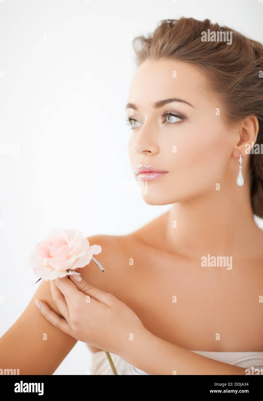 young woman with rose flower Stock Photo - Alamy