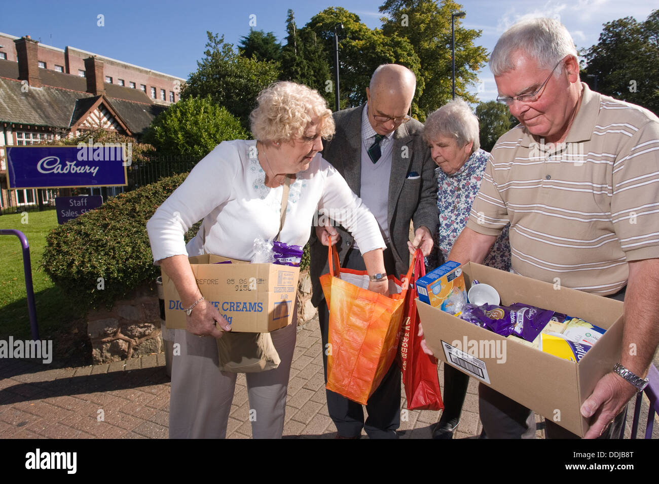 Former employees collecting chocolate at the Cadbury chocolate factory in Bournville Village, England, United Kingdom Stock Photo