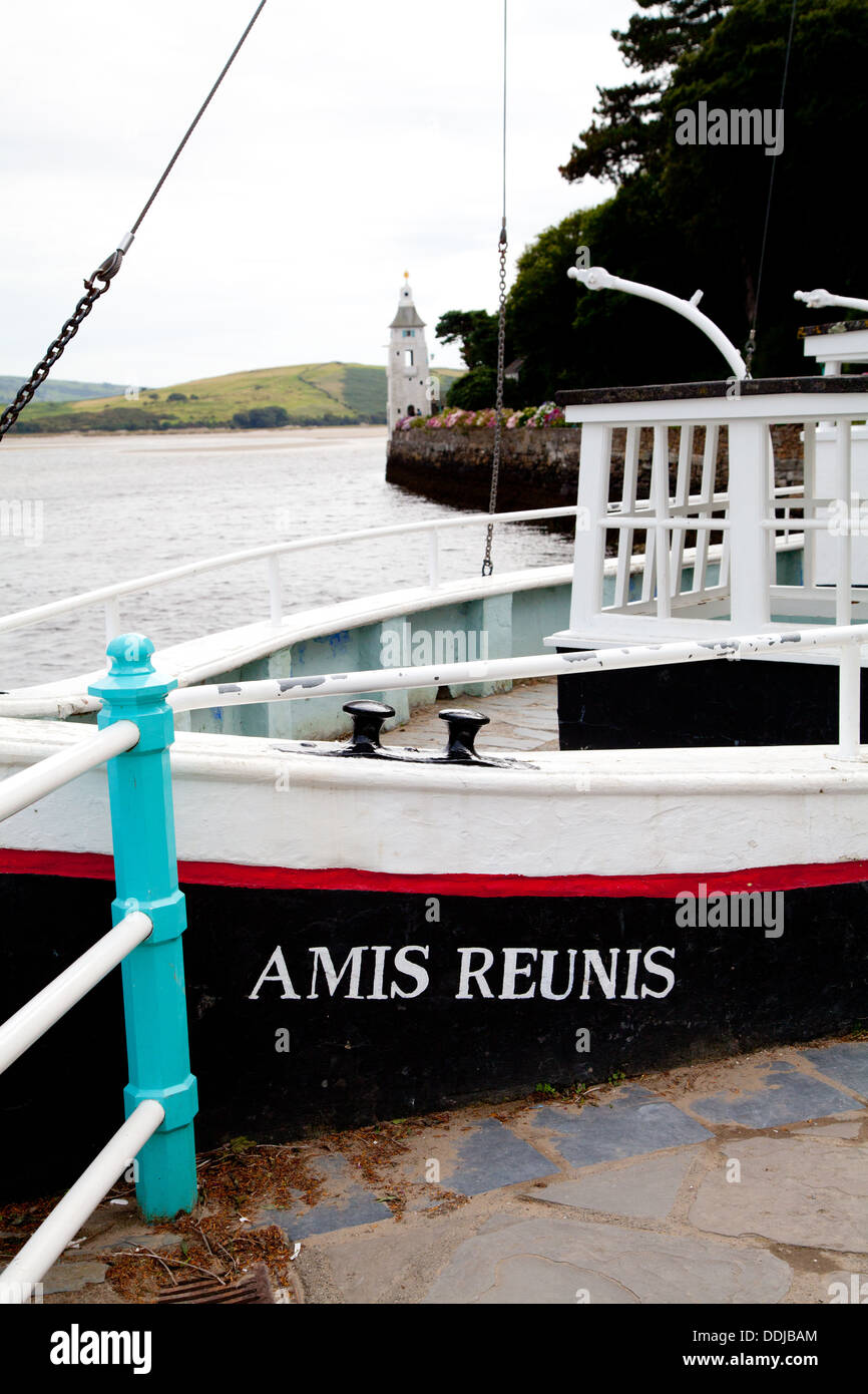 Amis Reunis stone boat on the quayside in Portmeirion with Observatory Tower in the distance Stock Photo