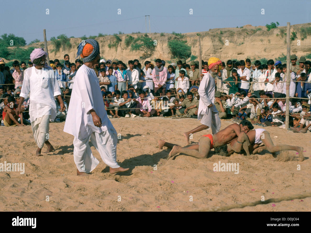 Traditional indian wrestling ( Kushti in hindi) with referees Stock