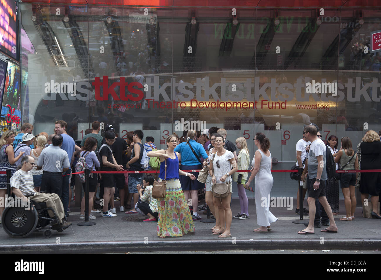 The discount theater ticket booth for same day tickets is always crowded in times Square, NYC. Stock Photo