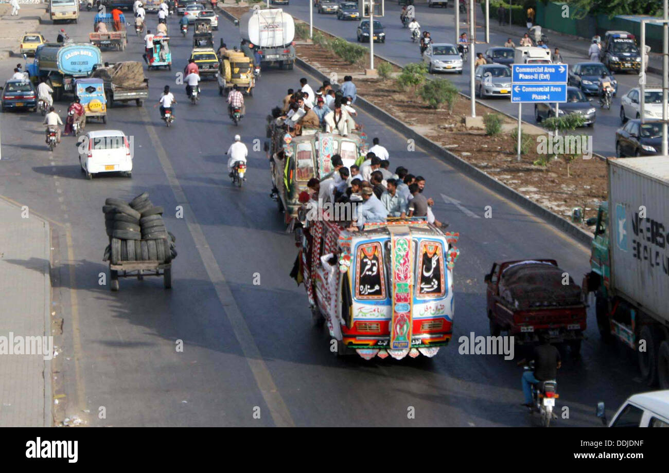 Karachi, Pakistan. 03rd Sep, 2013. Passengers traveling on an overloaded bus as the short of public transport is being observed due to closure of CNG Stations, in Karachi on Tuesday, September 03, 2013. Credit:  Asianet-Pakistan/Alamy Live News Stock Photo