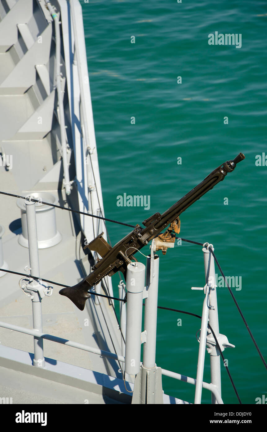 Fixed machine gun on a marine vessel in the port of Malaga, Spain. Stock Photo