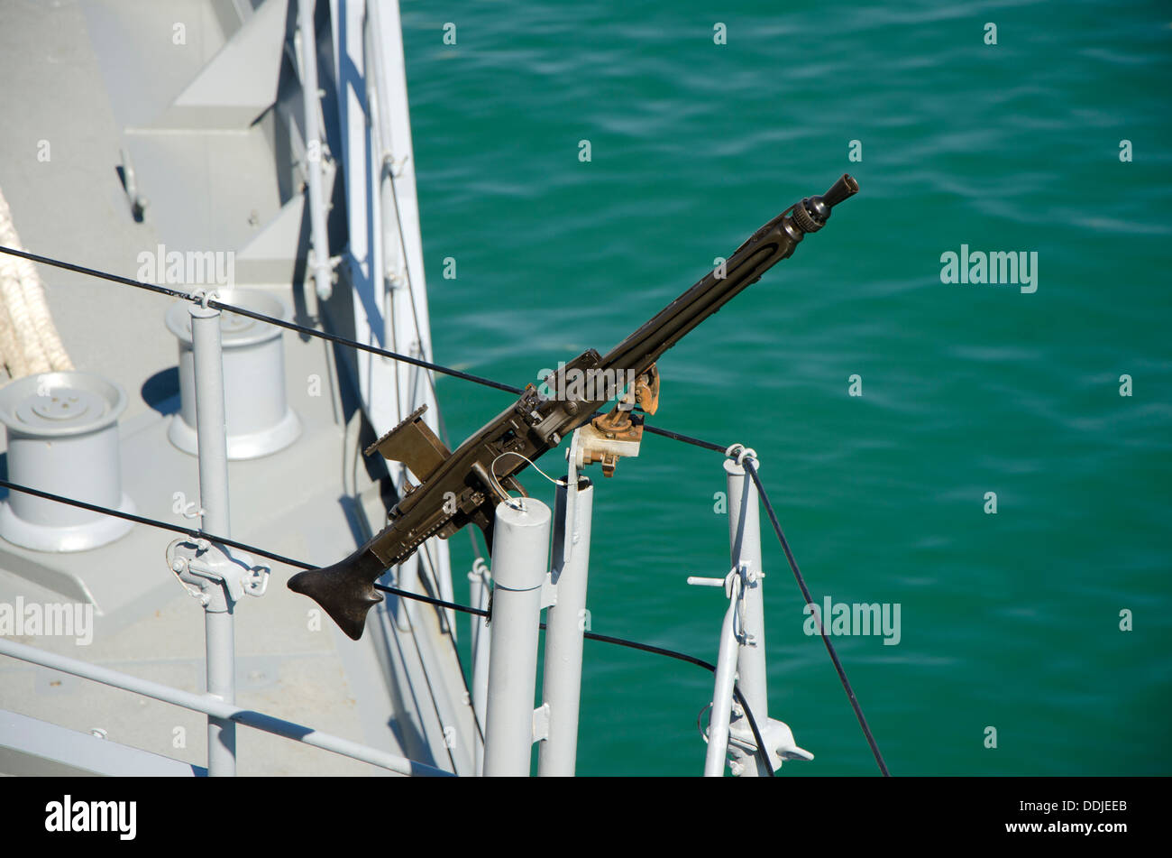 Fixed machine gun on a marine vessel in the port of Malaga, Spain. Stock Photo