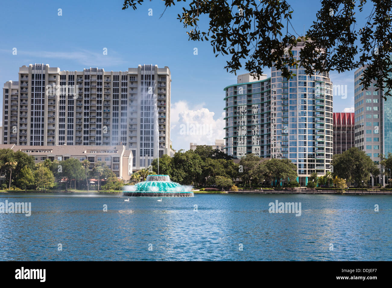 High rise buildings behind the fountain at Lake Eola in downtown Orlando Florida Stock Photo