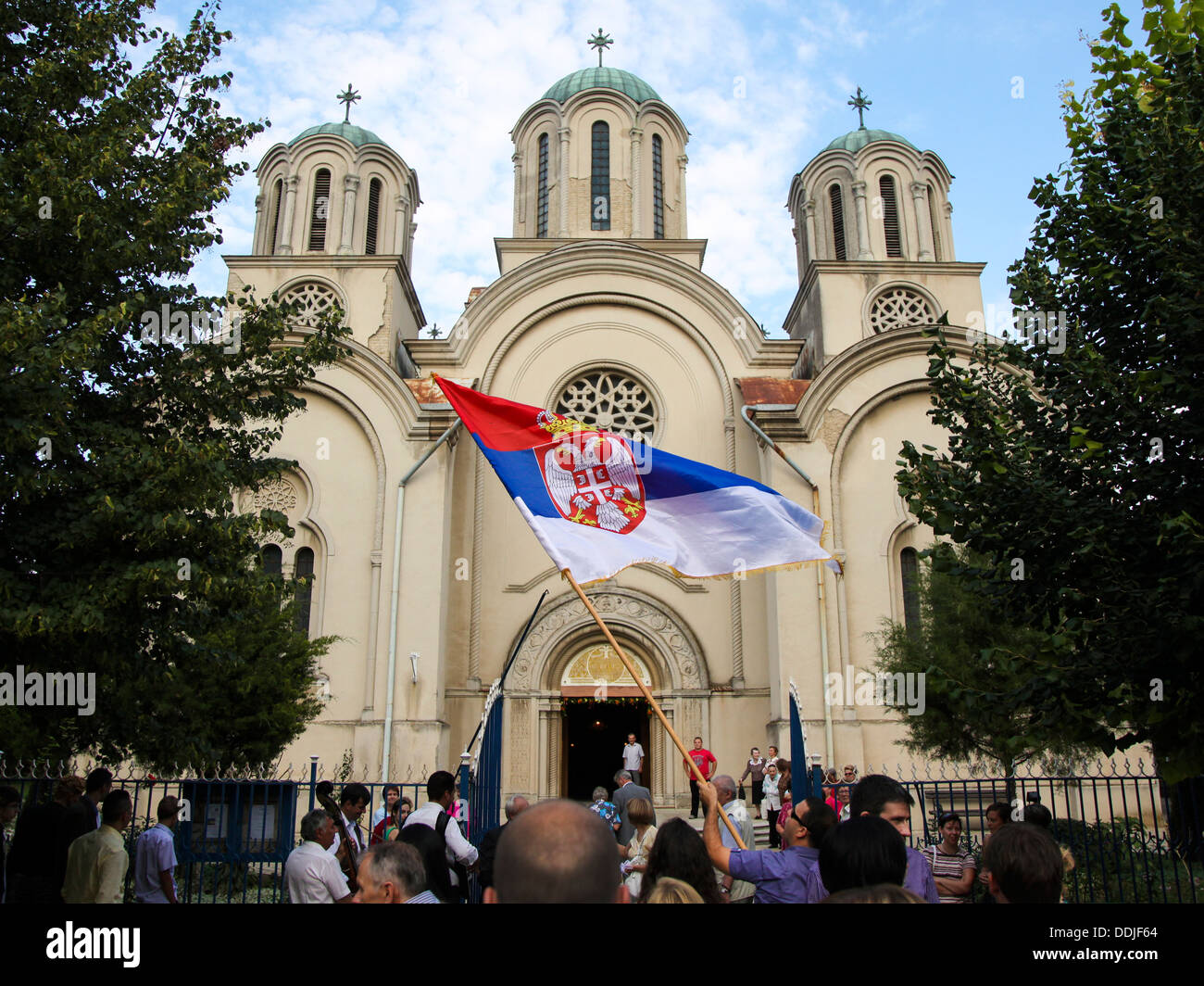 Wedding celebration in front of Orthodox church in Serbia Stock Photo