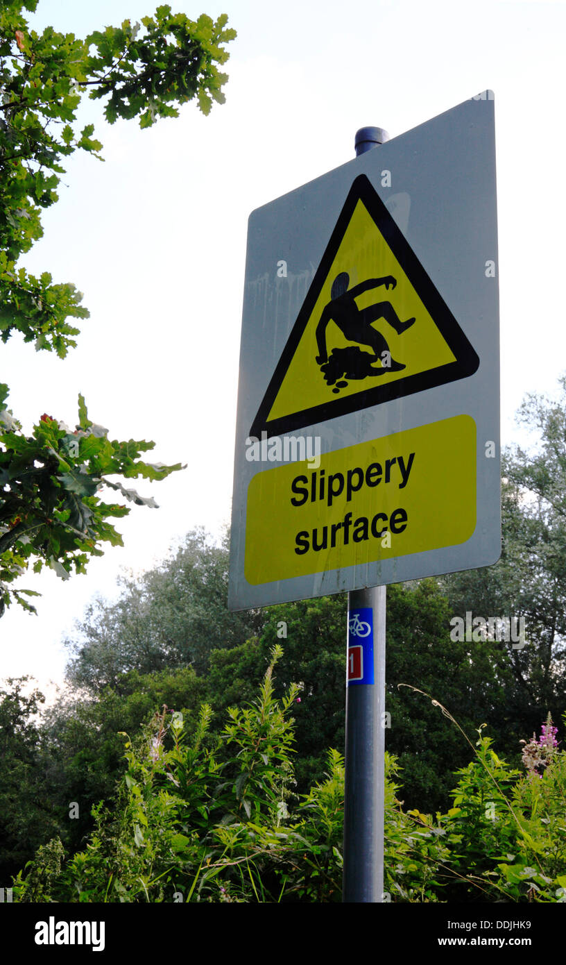 A slippery surface warning sign on the Marriotts Way long distance ...