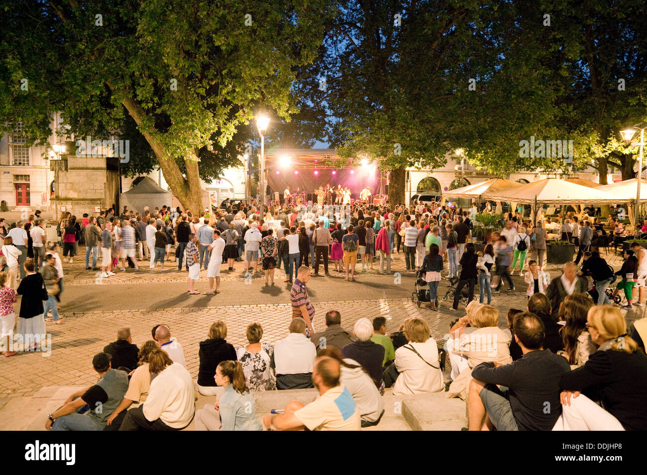 People listening to a concert in the town square at night, the town centre, Blois, Loir-et-Cher, Loire valley, France, Europe Stock Photo