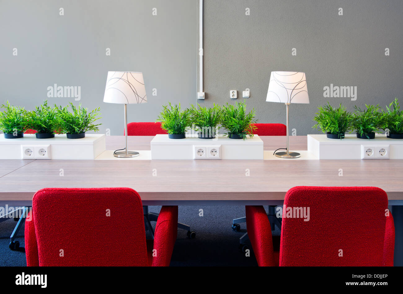 Flexible work spaces with power outlets in a modern open offfice interior design Stock Photo