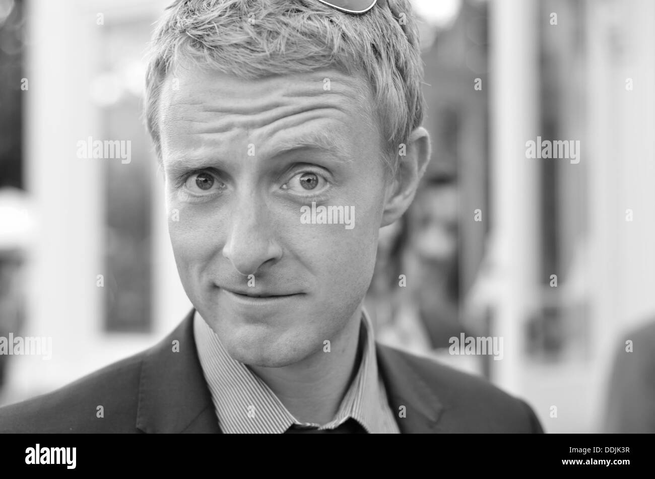 Blonde man in suit with tie in Black and White Stock Photo