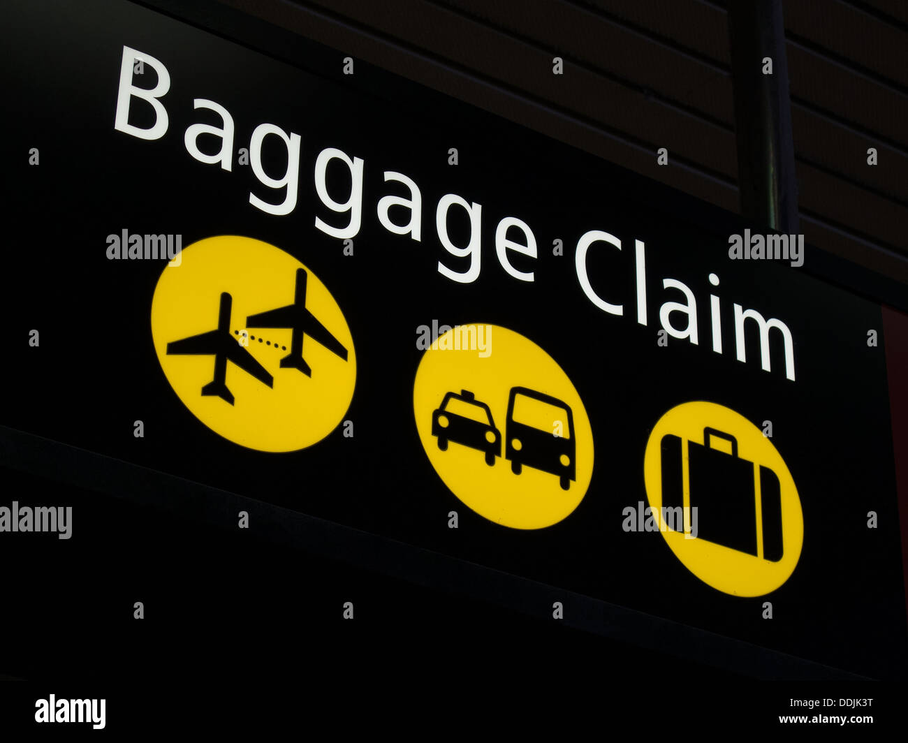 Airport baggage sign directing passengers to various areas of the airport Stock Photo