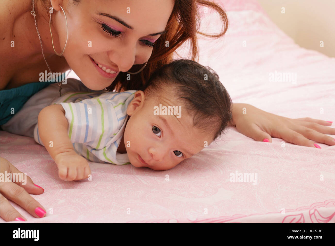 hispanic mother and her newborn baby Stock Photo
