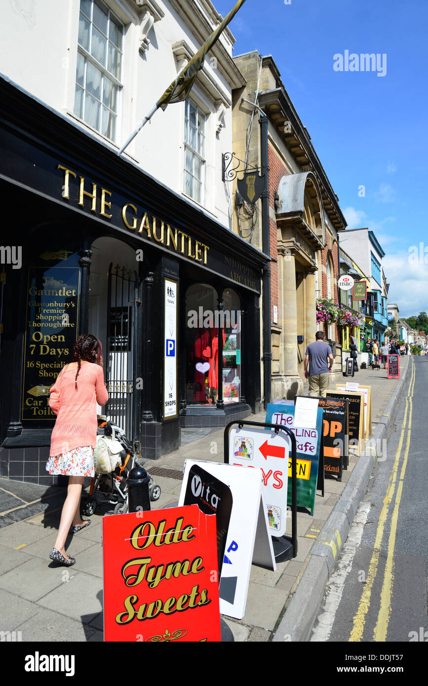 Advertising signs on footpath, High Street, Glastonbury, Somerset, England, United Kingdom Stock Photo