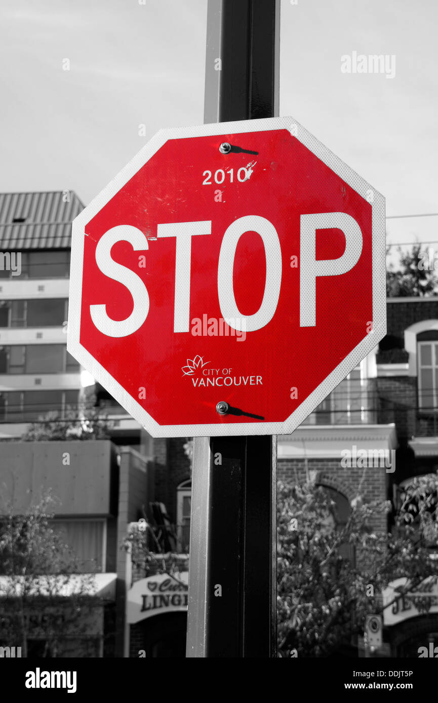 Red and white stop sign selective colour Stock Photo